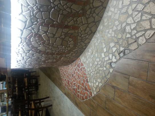 Palladian in travertine star in a restaurant in Rome.
